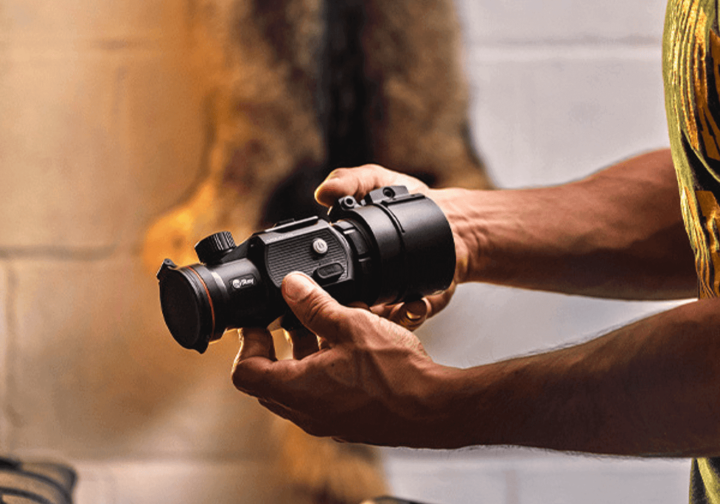 InfiRay MAL38 thermal imaging clip-on attachment, shown being held in a persons hands