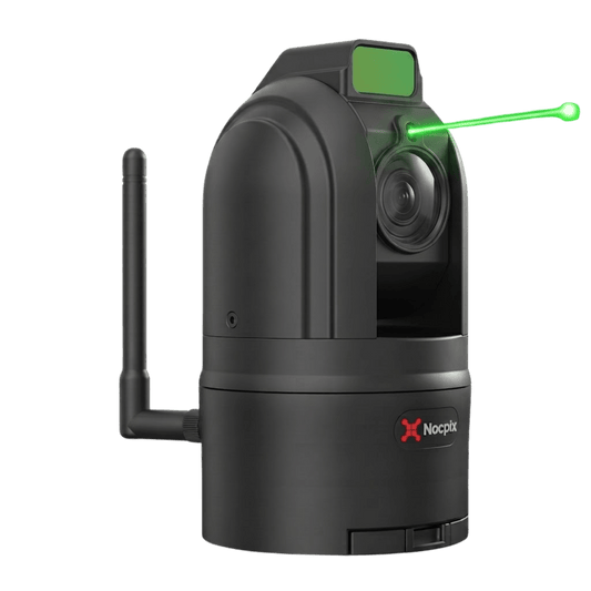 Front right view of a black Nocpix MT-M6T25SNA thermal camera with its modular battery compartment detached and resting on the flat white surface in front of the unit's base.