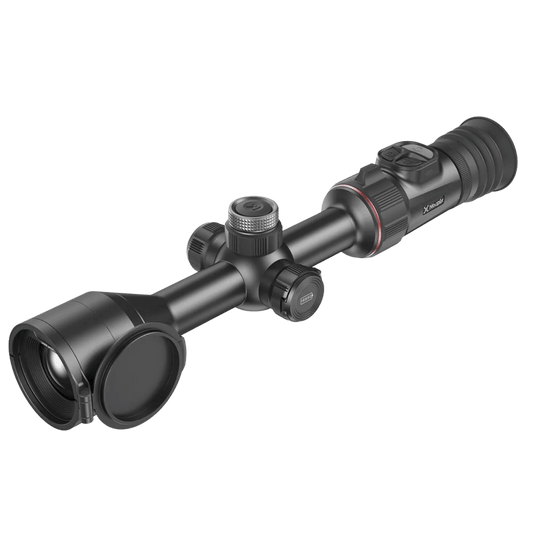 Front right perspective view of the Nocpix ACE 2 H35R thermal riflescope featuring the 35mm F0.9 objective lens, flip-up lens cap, central turret focus wheel, and ergonomic control pad.