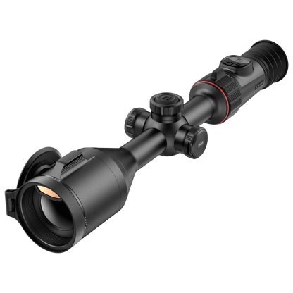 the Nocpix ACE S60R, shown from a front-left, slightly elevated angle. The scope is black with a tube-style body, featuring a large objective lens with an open cap, several turrets for adjustments, and an eyepiece at the rear with a red ring accent. It appears robust and designed for precision.