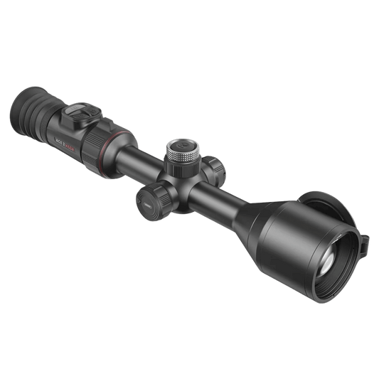 Front left perspective of the Nocpix ACE 2 H50R thermal scope showing the side battery cap for swappable 18650 cells, the main 30mm chassis tube, and the 50mm front bell housing