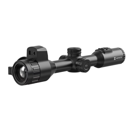 Hikmicro STELLAR SH35L 3.0 thermal imaging riflescope, shown from the side at a slight angle. It is black with a large objective lens on the left and multiple dials and buttons for adjustments on the top and right. There is also a small protrusion on the top left side for battery installation.