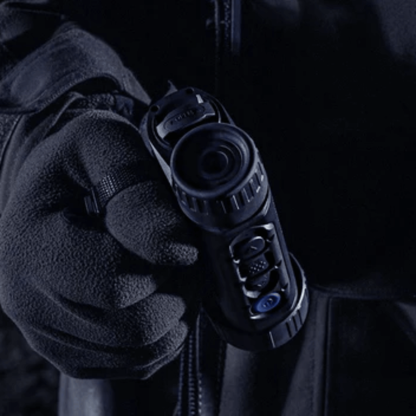 Pulsar Axion 2 XQ35 Pro monocular being held by a farmer